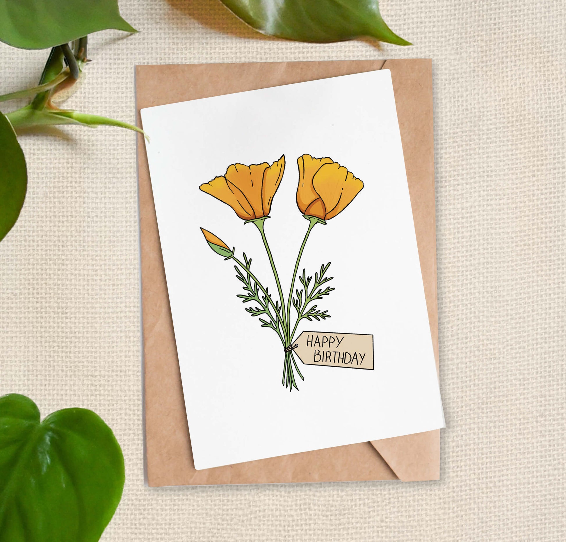 Greeting card illustration of three California poppies, two blooms and one bud, tied with a "Happy Birthday" tag. 