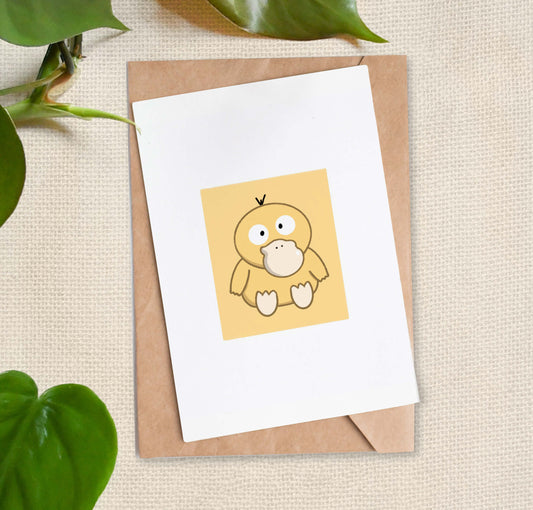 Illustration of yellow duck Pokemon, Psyduck, sitting in center of greeting card. 