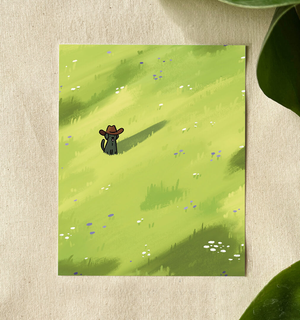 Illustration of a cute black dog with its tongue out and tail wagging, wearing a cowboy hat stands in a bright green field dotted with purple and white wildflowers. 