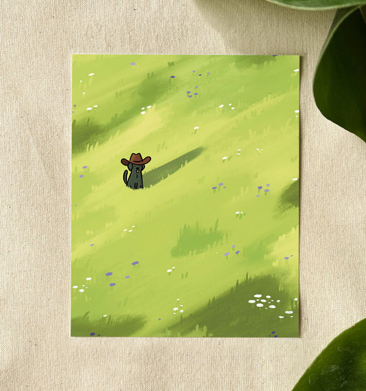 Illustration of a cute black dog with its tongue out and tail wagging, wearing a cowboy hat stands in a bright green field dotted with purple and white wildflowers. 