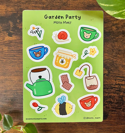 Cute sticker sheet titled "Garden Party" on a grass background. Includes drawings of tea cups, a teapot, honey jar, bee, snail, and flowers.