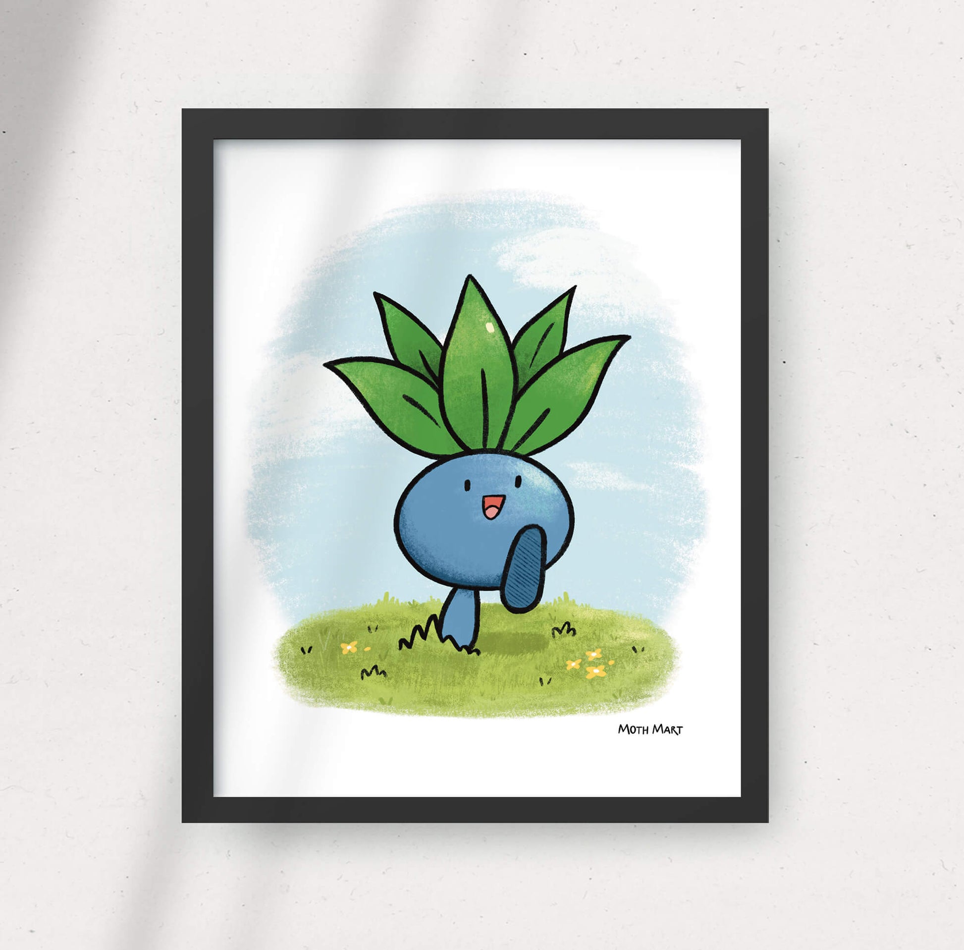 Framed illustration of a blue creature with green leaves on a white background