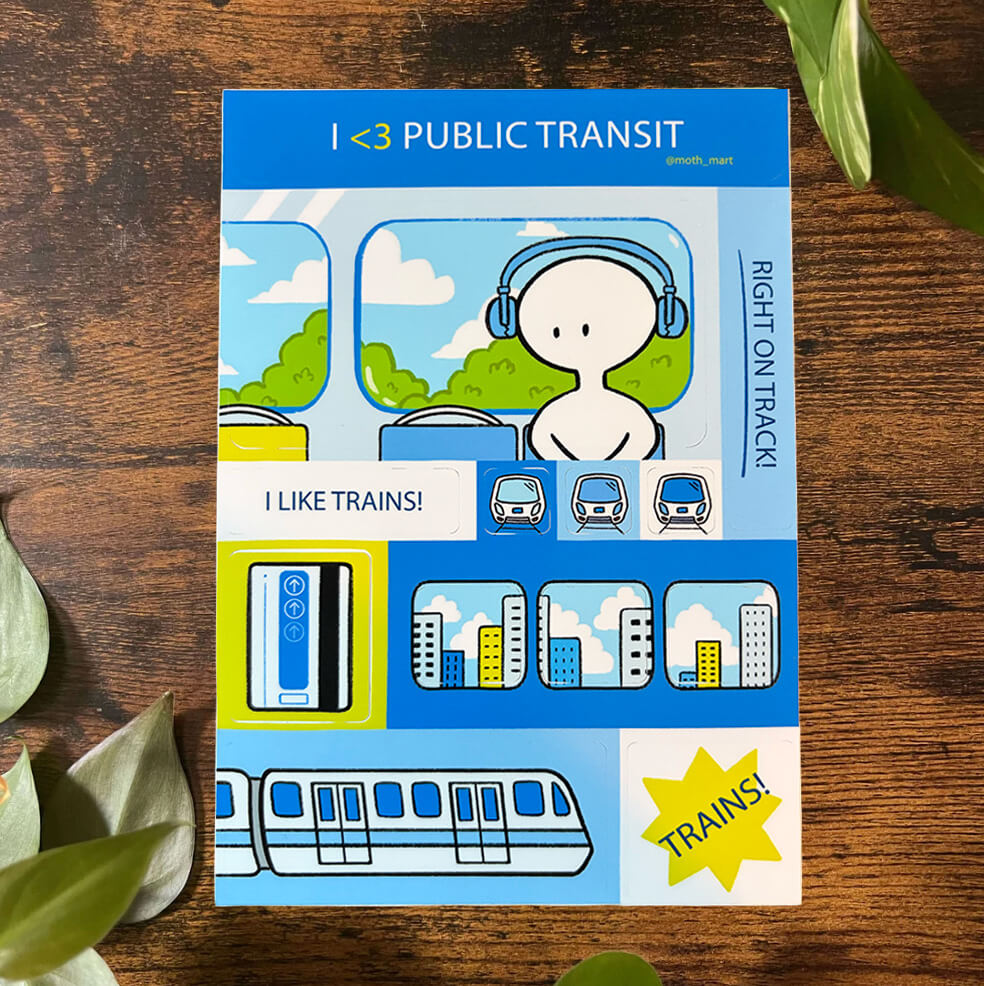 Blue sticker sheet featuring trains on a wood background with green leaves.