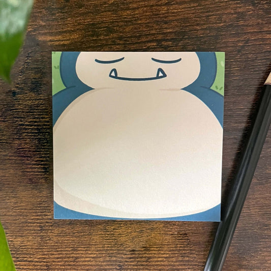 Sleeping normal type sticky notes pad, mainly showing his belly with a pencil off to the side.